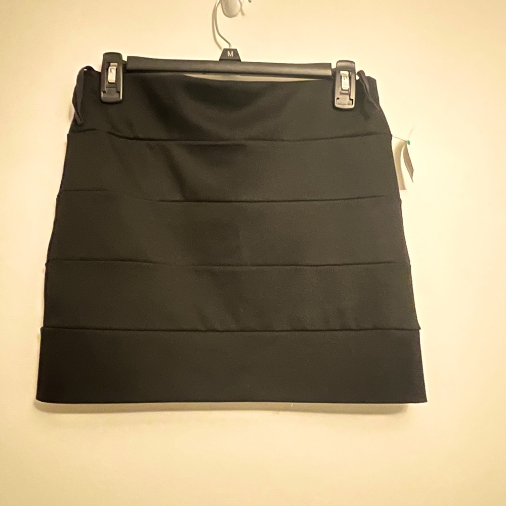 Body Central Black, mini skirt. Form fitting. Size M-L